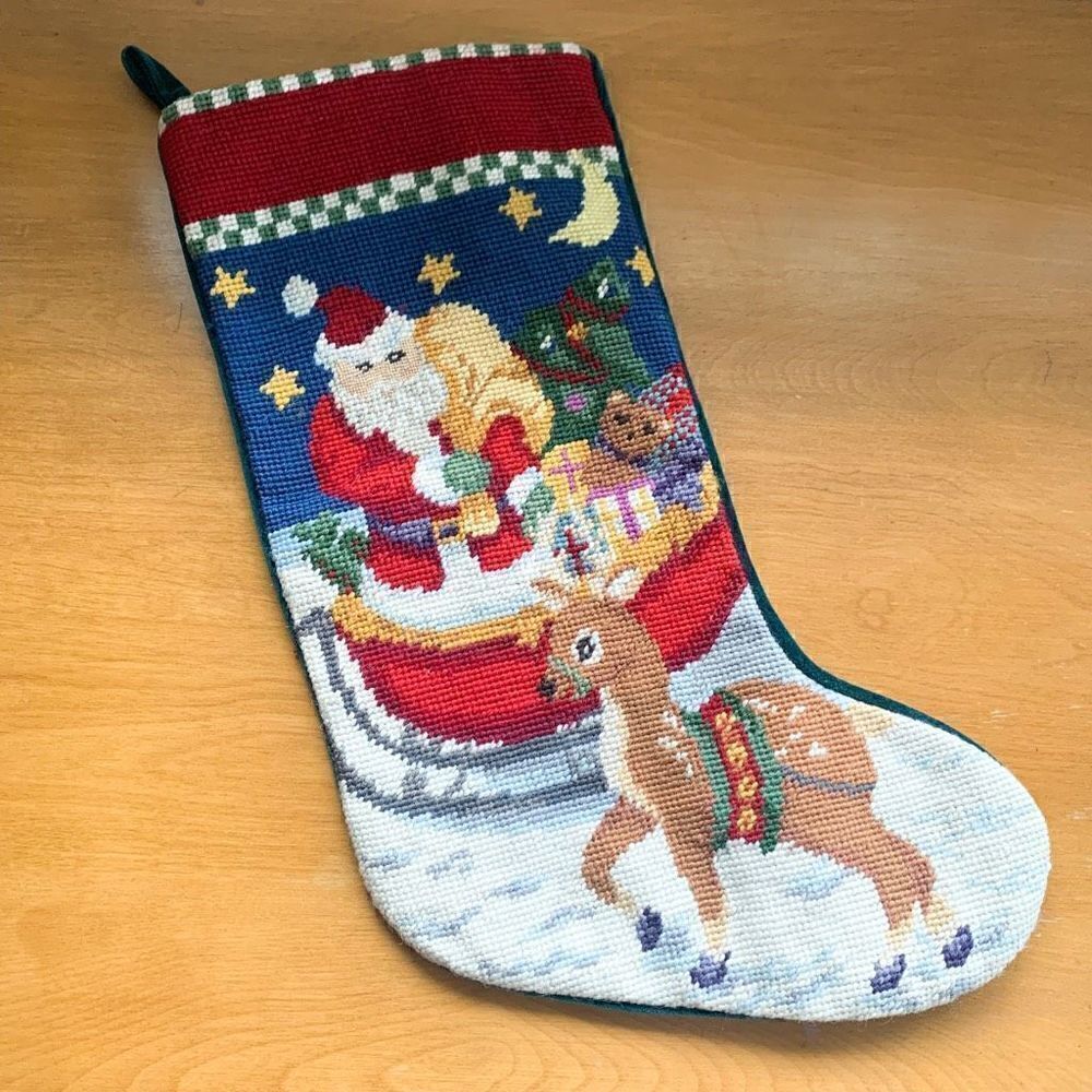 Vintage wool needlepoint Santa in a sleigh with a reindeer